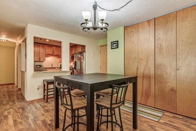 Dining Room into kitchen - 4860 Park Commons Dr Unit 217