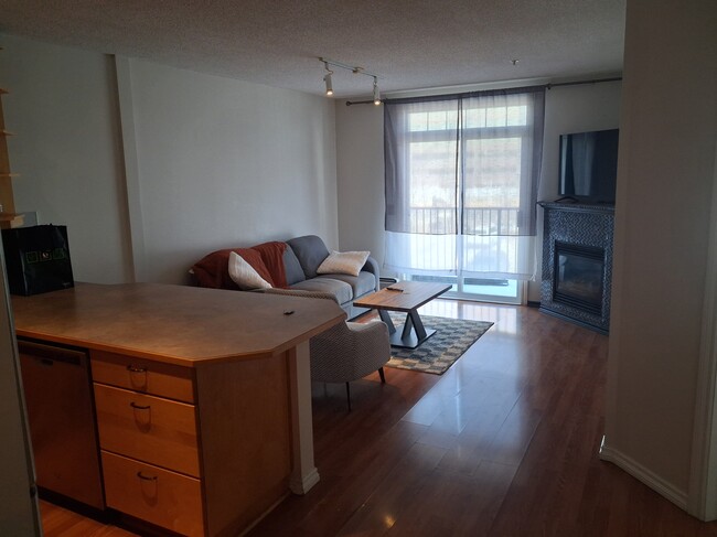Photo - Modern 2-Bedroom Condo with Underground Parking in Prime Calgary Location Unit 1