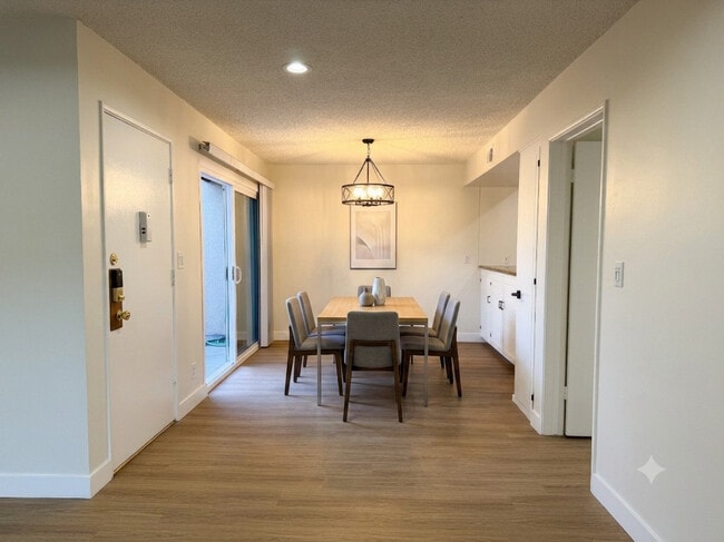 Dining Area with Modern Wood Style Floors - The Huntington Sunset