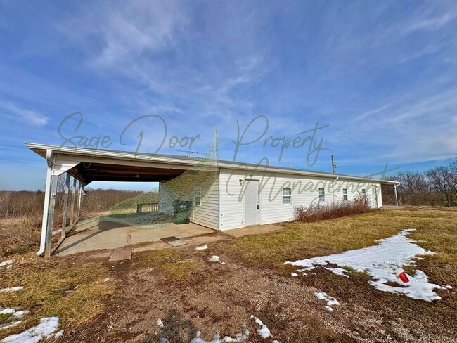 Building Photo - 117 NE State Hwy E Unit 117  A