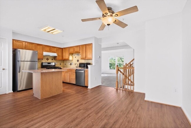 Photo - 3BR Townhome in Russett | 3 Levels | Walkout Basement + Deck | $2,400/mo** Beautiful 3-level town...