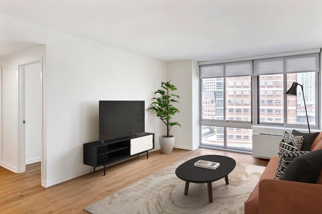 Renovated Package I living room with hard surface flooring