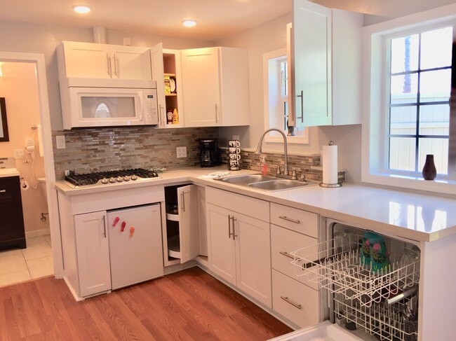 Kitchen with refrigerator, stove, microwave, and dishwasher - 1348 S Curson Ave Unit 1348 S Curson Ave.