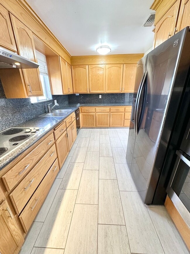 Photo - Spacious 4BD/2BA Two-Story Home with Yard, Fireplace & Parking in The Plaza