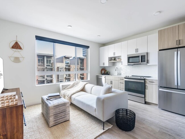 Unlock your outdoor oasis at Modera Golden Triangle. Certain Modera homes feature private balconies and patios just steps from your kitchen, offering a perfect blend of indoor-outdoor living in Denver. - Modera Golden Triangle Apartments