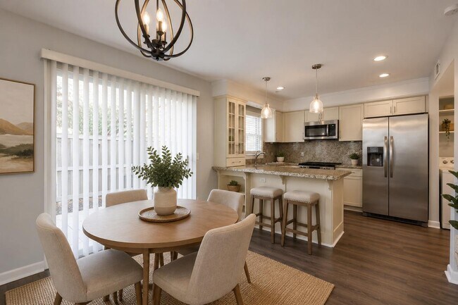 Open-concept dining area conveniently connected to the kitchen, creating a functional and welcoming