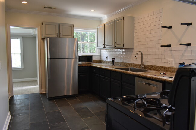 (upstairs kitchen shown) styling similar to downstairs unit kitchen - 2303 Goldsmith St Apartment Unit 2303