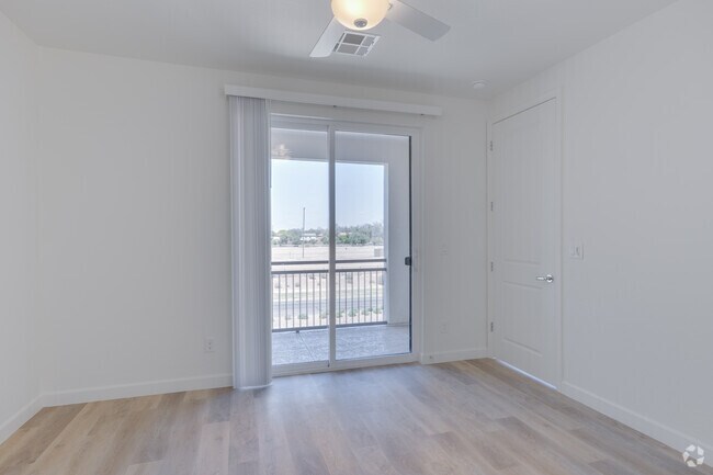 3BR, 2BA - 1,572SF - Primary Bedroom - Woodcrest at Power Ranch Apartments