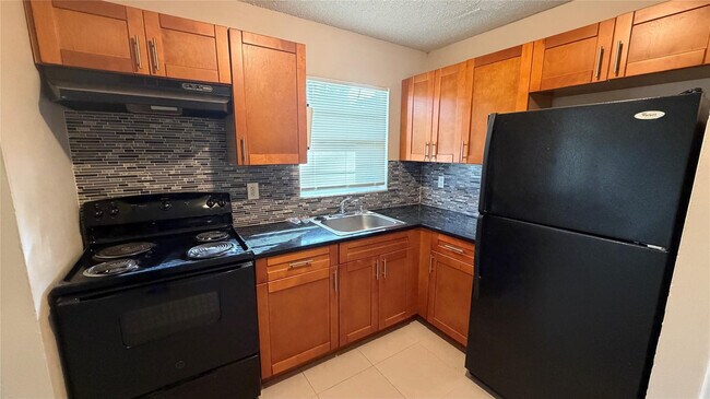 Building Photo - 5180 NE 6th Ave Unit 602