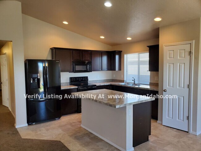 Photo - Office, vaulted ceilings, 2-car garage and...