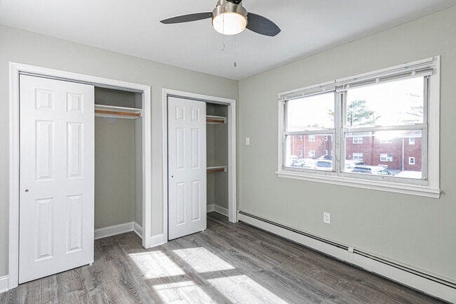 Spacious custom closets and ceiling fans in bedrooms - Troy Hills Village