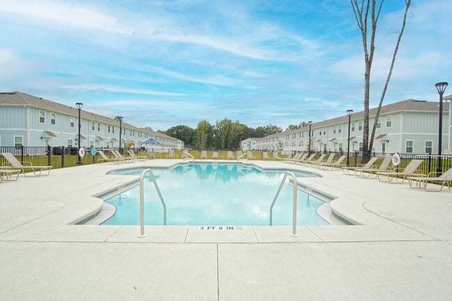 Photo - Spacious 3BR/2.5BA Townhome with 1-Car Garage in Admiral’s Quarters—Pool, Dog Park, Near 9 Mile R...