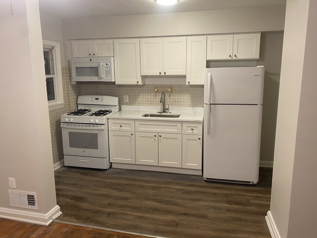 Brand new kitchen! New cabinets, quartz countertop, stove and microwave! - 7125 Gough St Townhome