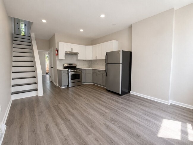 Photo - Spacious 4 Bedroom Home with Private Backyard & Flexible Living Space