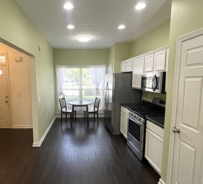 Photo - End Unit Townhome - Included in the RENT Water, Trash and Lawncare!