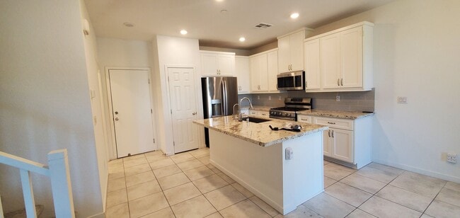 Photo - Beautiful townhome features a bright, open-concept layout