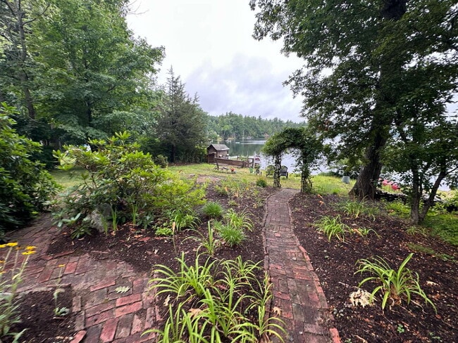 Photo - Peaceful Waterfront Living: 2-Story Home on River Road with Ample Outdoor Storage & Water Extras!