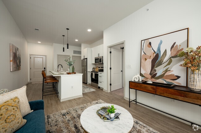Model - 1BR, 1BA - 691SF - Living Room/Kitchen - Versa