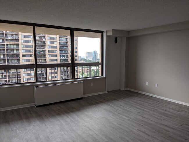Living room with door to balcony - 3701 S George Mason Dr Unit 1901N