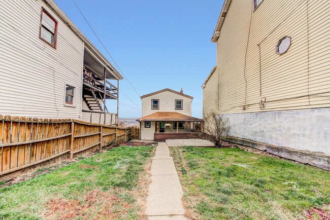 Photo - AVAILABLE JUNE 2026 -  4 Bedroom Full Renovation w/ Stunning Hilltop View & Central AC!