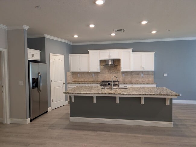 Photo - Modern 5 bedroom 3 bathroom home in the Riverstone Community offering solar, In-laws suite, den o...