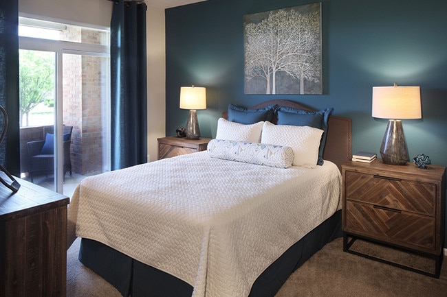 Select floor plans include bedrooms with attached patios - The Meadows at Meridian Apartments