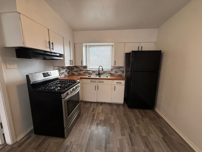 Photo - **50% Off First Month's Rent!** Renovated 4 Bedroom Home with Updated Floors & Modern Kitchen