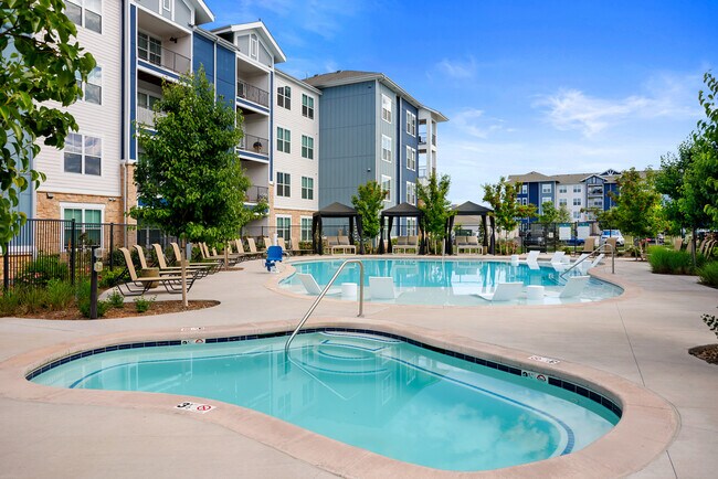 Soak up the sunshine by the sparkling pool. - Lofts at Highlands