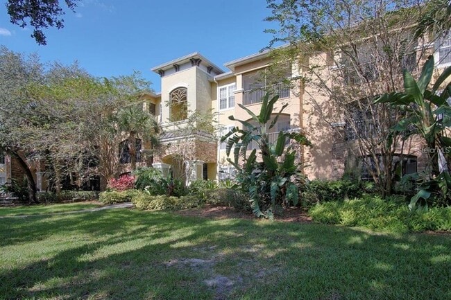 Building Photo - 10019 Courtney Palms Blvd Unit 302