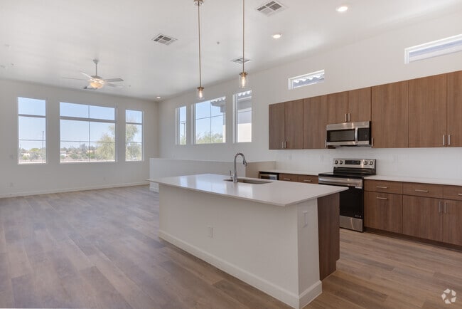 3BR, 2BA - 1,572SF - Kitchen - Woodcrest at Power Ranch Apartments