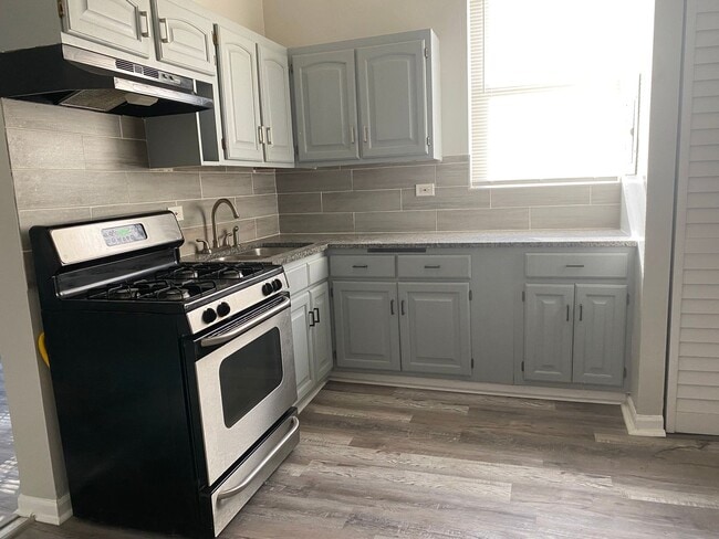 Building Photo - 7614 S Maryland Ave Unit 1