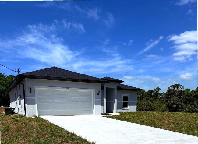 Photo - New 4 Bed / 2 Bath / 2 Car Garage Family Retreat in Desirable Lehigh Acres!