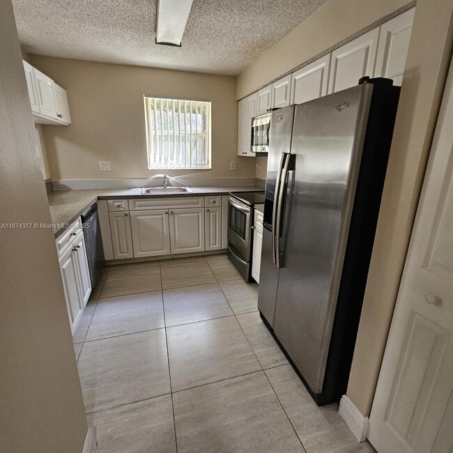 Photo - 741 N Pine Island Rd Unit 212