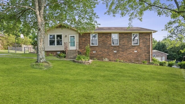 Building Photo - For Rent : 4BR, 1 1/2BA home with fenced in back yard and storage building.