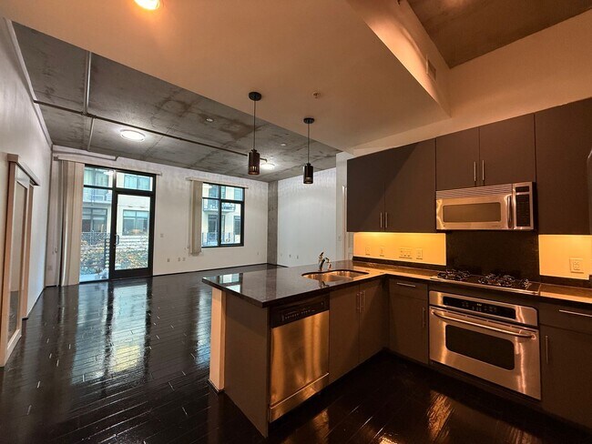 Building Photo - Modern 1BR/2BA Condo with 2 Parking Spaces...