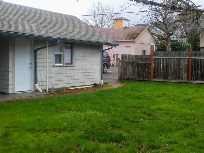 Backyard looking toward parking area - 308 NW Kings Blvd House