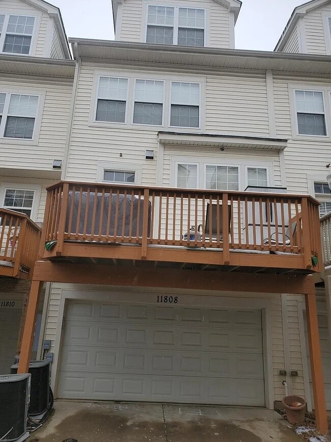 Rear with 2 car garage - 11808 Oxbridge Dr