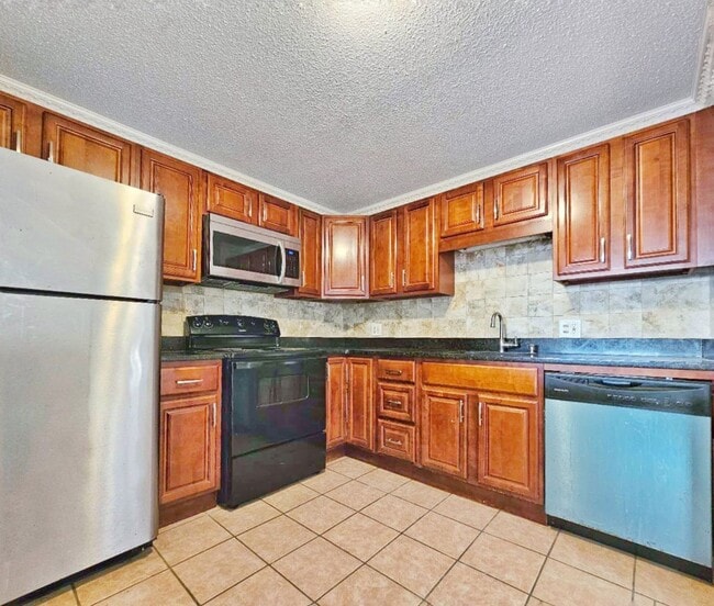 Photo - Beautiful renovated 3 bed 2 bath townhouse with deeded parking and easy Highway access