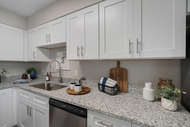 Kitchen with granite counters, stainless appliances, and modern cabinetry