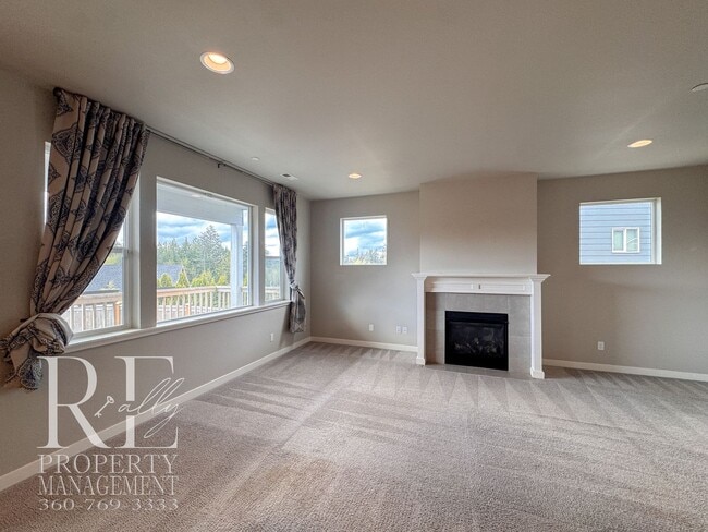 Photo - Vaulted Ceilings, Tree-Lined Views & a Spacious Primary Suite Retreat