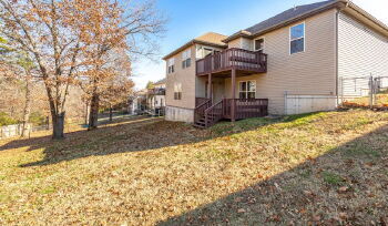 Basement home with a fenced in backyard