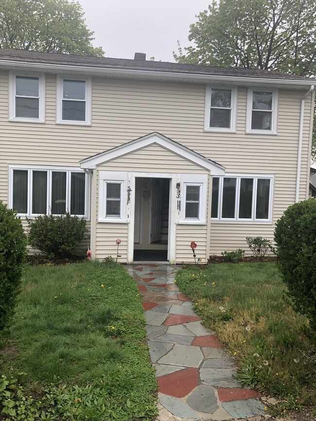 Right side of 2-family house with yard and parking - 53 Sagamore Rd Townhome