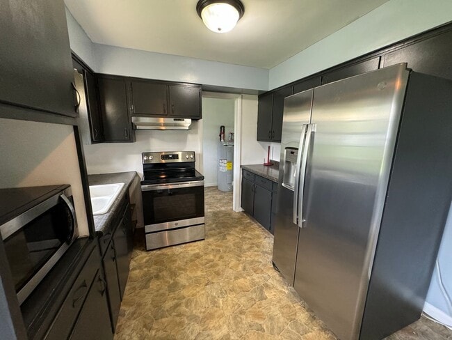 Photo - Charming 3-Bedroom, 1-Bathroom Home with Attached Garage – Accepting Section 8