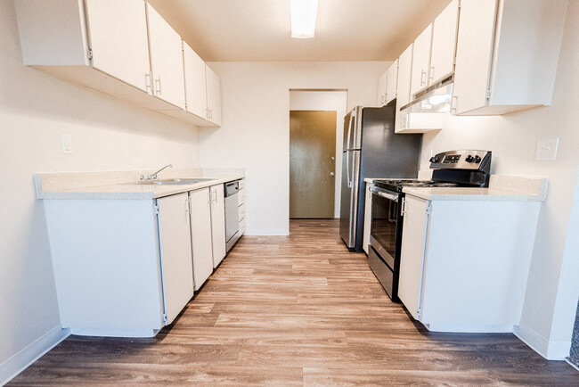 Lakewood Apartments - Arbor Pointe Apartments - Kitchen and Entryway, from Dining Room - Arbor Pointe Apartments