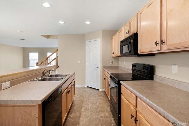 Photo - Bright Open-Concept Condo with 1-Car Garage in Prime Commuter Location