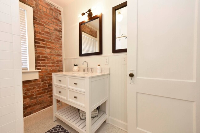 Exposed Brick and custom Bathroom Accents