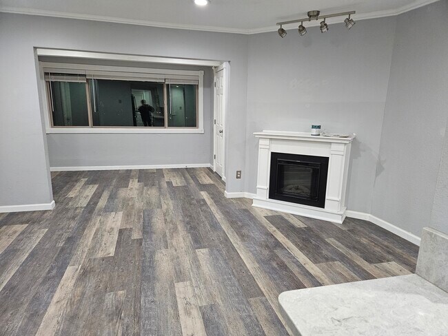 Livingroom with electric FP - 12505 NE 23rd Pl Condo Unit A-2