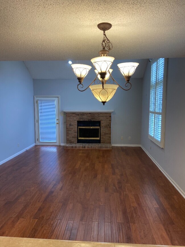Large living room with gas fireplace - 10401 Ravenbrook Ln Unit 10401
