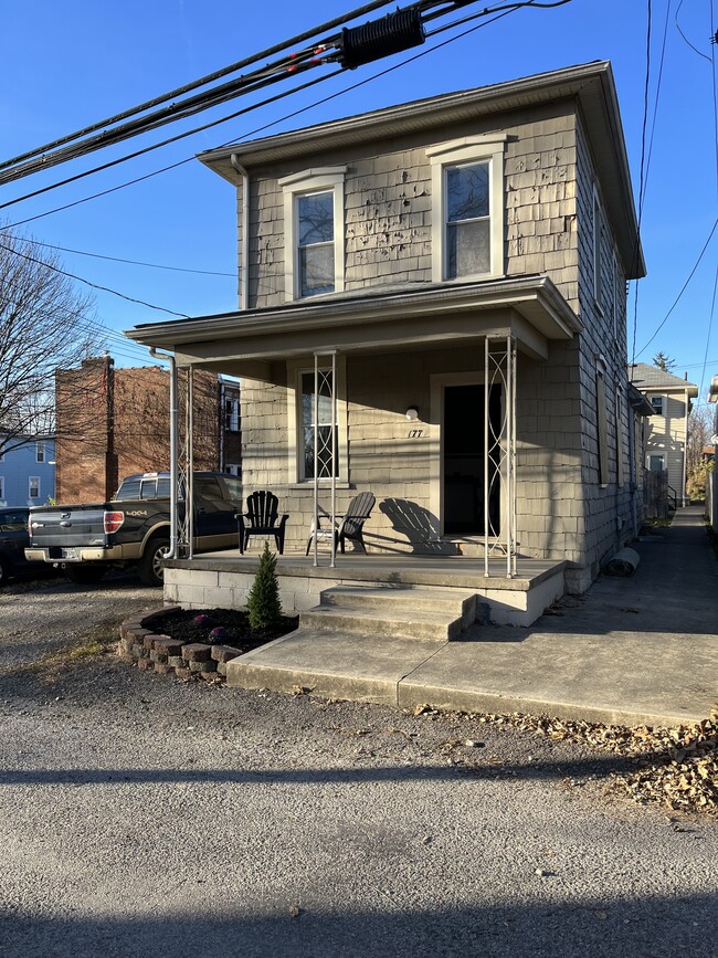 Front exterior and porch - 173 E Duncan St Townhome