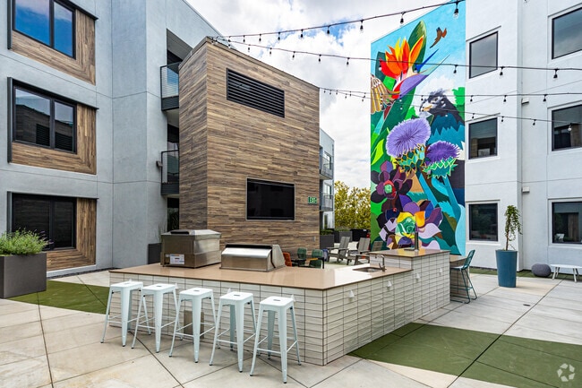 Courtyard & BBQ Area - Exhibit at J Town Apartments